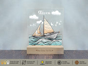 a glass block with a picture of a sailboat