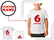 a young boy wearing a white t - shirt with the number six on it