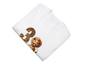 a white t - shirt with a picture of a lion on it