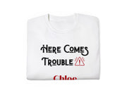 a white t - shirt that says, here comes trouble