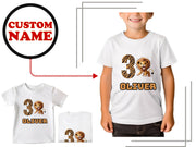 a young boy wearing a custom name and a lion t - shirt