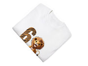 a white t - shirt with a picture of a lion on it