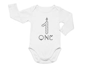 a white bodysuit with a candle on it