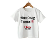 a white t - shirt that says, here comes trouble