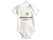 a white bodysuit with the words birthday joy on it