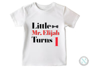 a white t - shirt with the words little, mr elphah turns 1