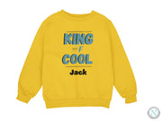 a yellow sweatshirt with the words king of cool printed on it