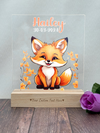 a wooden block with a picture of a fox on it