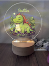 a glass plaque with a picture of a dinosaur on it