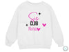 a white sweatshirt with pink lettering and hearts