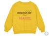 a yellow sweatshirt with the words rockstar on it