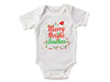 a white baby bodysuit with merry bright sparklers on it