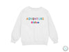 a white sweatshirt with the words adventure written on it