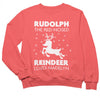 a little girl wearing a red sweatshirt that says rudolph the red - nosed reindeer loves